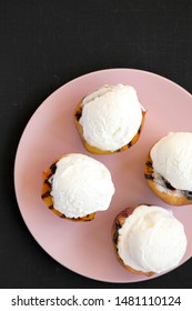 Homemade Grilled Peaches With Vanilla Ice Cream On A Pink Plate On A Black Background, Top View. Flat Lay, Overhead.