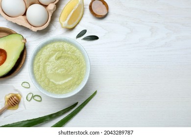 Homemade Hair Mask In Bowl And Ingredients On White Wooden Table, Flat Lay. Space For Text