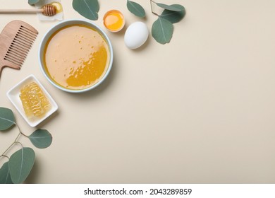 Homemade Hair Mask In Bowl, Ingredients And Bamboo Comb On Beige Background, Flat Lay. Space For Text