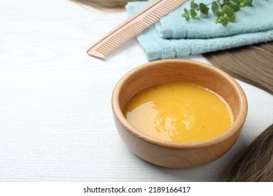 Homemade Hair Mask In Bowl On White Wooden Table. Space For Text