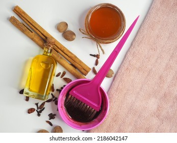 Homemade Hair Mask With Cinnamon, Nutmeg, Cloves, Cayenne Pepper. Natural Cosmetic Product In A Small Bowl, Application Brush, Ingredients For A Diy Hair Growth Product. Flat Lay.