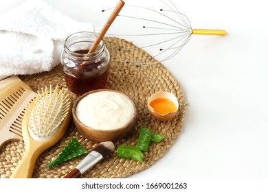 Homemade Hair Mask And Ingredients For Moisturizing Honey, Egg, Yogurt, Aloe On White Background.hair Treatment