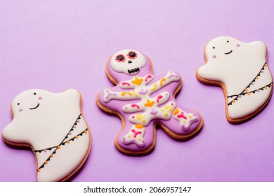 Homemade Halloween Cookies, Ghosts, Flying Mice On Purple Background.