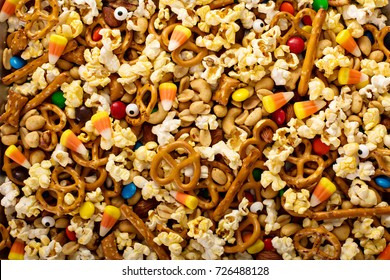 Homemade Halloween Trail Or Snack Mix With Candycorn, Popcorn, Pretzels And Nuts Overhead Shot