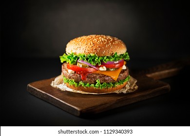 Homemade hamburger or burger with fresh vegetables and cheese