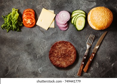 Homemade Hamburger With Ingredients On Dark Slate Background Top View With Space For Text