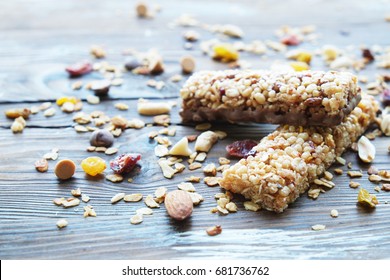 Homemade Healthy Cereal Bars With Granola, Nuts And Dried Fruits On Wooden Background.