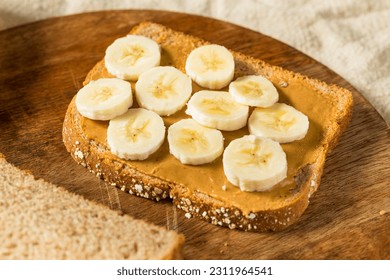 Homemade Healthy Peanut Butter Banana Sandwich on Wheat Bread - Powered by Shutterstock