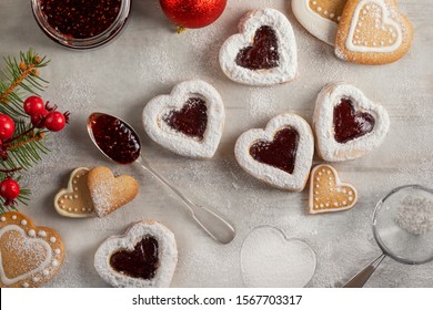 Homemade heart shaped  cookies with raspberry jam on white wooden table  for Christmas or  Valentine's day. Top view. - Powered by Shutterstock