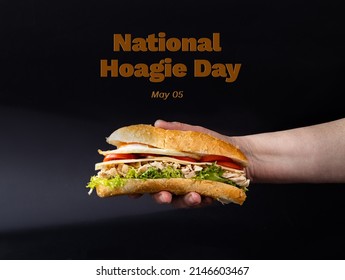 Homemade Hoagie With Meat Chicken Egg, Lettuce And Tomato. Official Sandwich Of Philadelphia. National Hoagie Day Concept. The Name Of The Holiday Is Written Over The Image