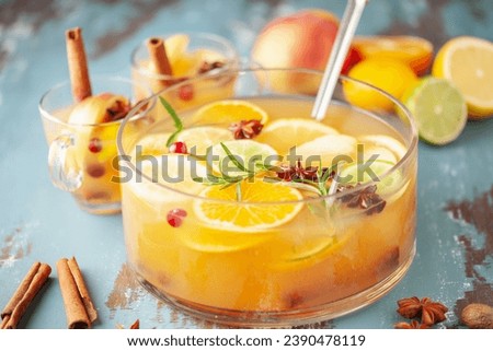 Homemade hot alcohol mulled apple cider punch with cinnamon sticks, anise star and spices