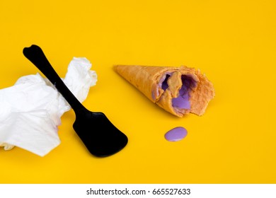 Homemade Ice Cream In Broken Waffle Cone With Wafer Crumb Over Yellow Background. 