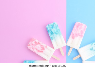 Homemade Ice Cream Sticks , Popsicle , Ice Pop Or Freezer Pop On Blue And Pink Pastel Colors Background 