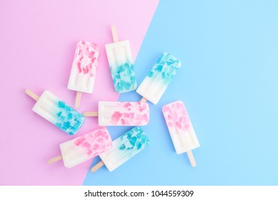 Homemade Ice Cream Sticks , Popsicle , Ice Pop Or Freezer Pop On Blue And Pink Pastel Colors Background