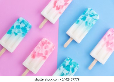 Homemade Ice Cream Sticks , Popsicle , Ice Pop Or Freezer Pop On Blue And Pink Pastel Colors Background