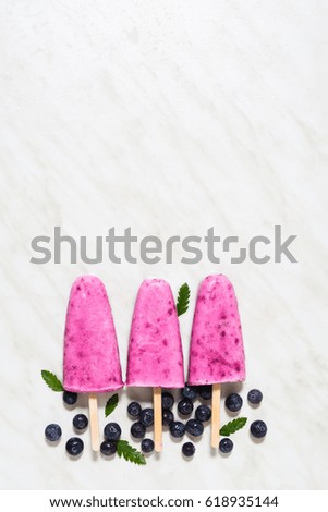 Similar – Image, Stock Photo Red fruit ice cream on a stick