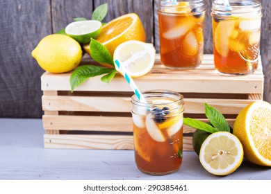 Homemade iced tea in mason jars with straws