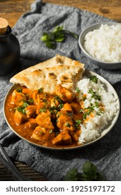 Homemade Indian Butter Chicken with Rice and Naan Bread