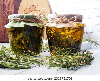 Homemade Infused Olive Oil Jars with rosemary and thyme - Powered by Shutterstock