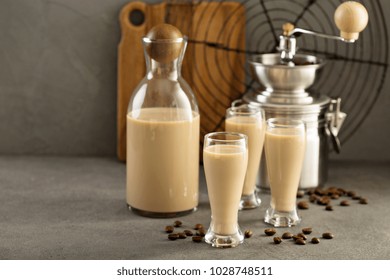 Homemade Irish Cream And Coffee Liquor In A Bottle And Shot Glasses