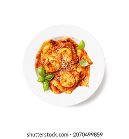 Homemade italian ravioli pasta, stuffed with spinach and ricotta ,served with tomato sauce, parmesan cheese and fresh basil leaves . isolated on white background , top view	