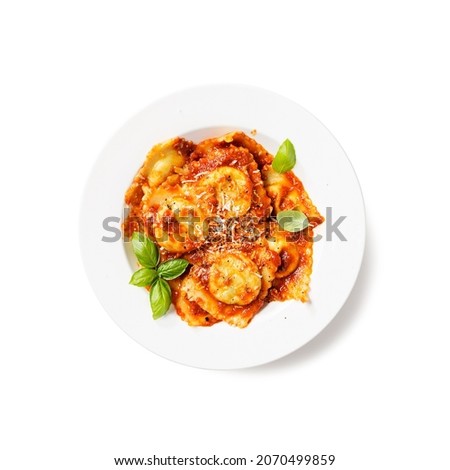 Homemade italian ravioli pasta, stuffed with spinach and ricotta ,served with tomato sauce, parmesan cheese and fresh basil leaves . isolated on white background , top view	