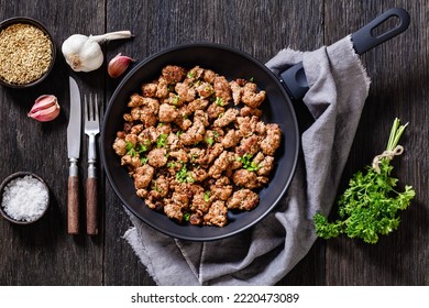 Homemade Italian Sausage Of Freshly Ground Pork Meat And Spices Fried In Skillet On Dark Wooden Table, Horizontal View  From Above, Flat Lay