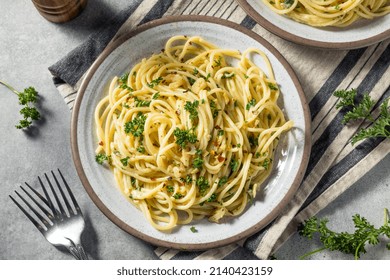 Homemade Italian Spaghetti Algio e Olio with Garlic and Parmesan - Shutterstock ID 2140423159