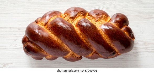 Homemade Jewish Challah Bread On A White Wooden Table, Overhead View. Top View, From Above, Flat Lay. Close-up.