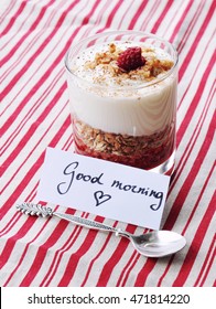 Homemade Layered Dessert Or Parfait With Granola, Raspberry Jam And Creamy Yogurt In A Glass And Good Morning Message. Breakfast On Valentine Day, Women's Or Mother's Day,hand Lettering. Love Concept. 