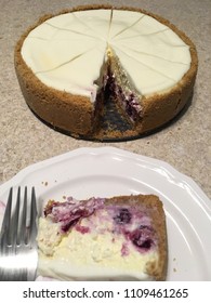 Homemade Lemon Blueberry Cheesecake With Single Slices Served.