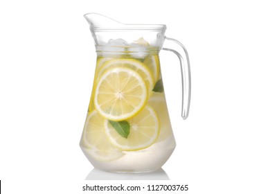 Homemade lemonade with mint and ice with a glass jug on a white background. isolated