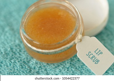 Homemade Lip Scrub Made Out Of Brown Sugar, Honey And Olive Oil In A Glass Jar