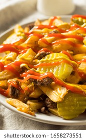 Homemade Loaded Cheeseburger Cheese Fries With PIckles And Ketchup