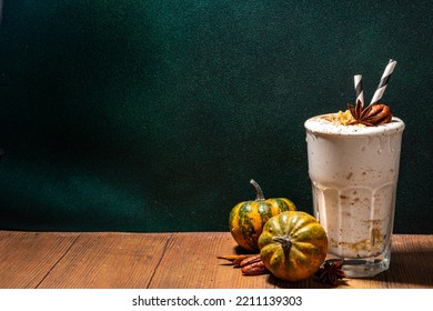 Homemade Loaded Pumpkin Spice Milk Shake With Ice Cream And Tart Crumble, In Single Glass With Little Pumpkins Decor, Pecan Nuts And Spices, Healthy Fall Seasonal Breakfast Drink