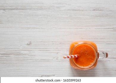 Homemade Mango Carrot Smoothie In A Glass Jar Mug, Top View. Flat Lay, Overhead, From Above. Copy Space.