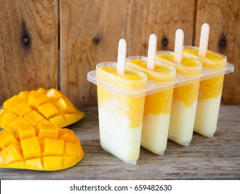 Homemade Mango And Yogurt Popsicle For Summer Ice Cream Dessert Concept.