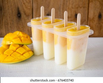 Homemade Mango And Yogurt Popsicle For Summer Ice Cream Dessert Concept.