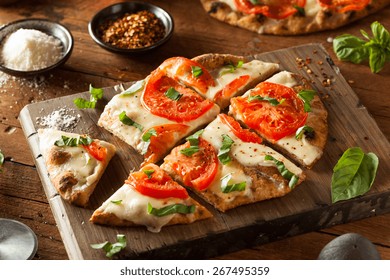 Homemade Margarita Flatbread Pizza With Tomato And Basil