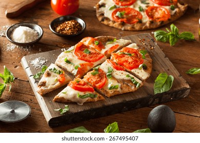 Homemade Margarita Flatbread Pizza With Tomato And Basil