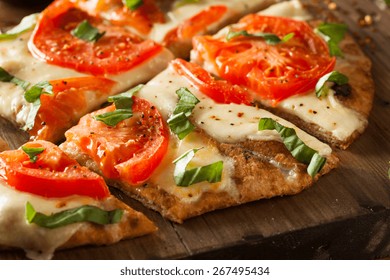 Homemade Margarita Flatbread Pizza With Tomato And Basil