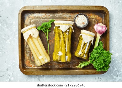 Homemade marinated asparagus in a glass jar. Food supplies. Top view. - Powered by Shutterstock