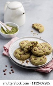 Homemade Matcha And Chocolate Chip Cookies On Light Concrete Background, Copy Space 