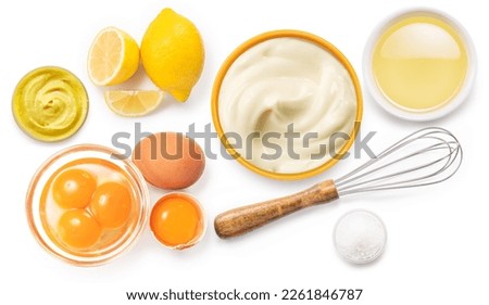 Homemade mayonnaise and mayonnaise ingredients isolated on a white background. Top view.