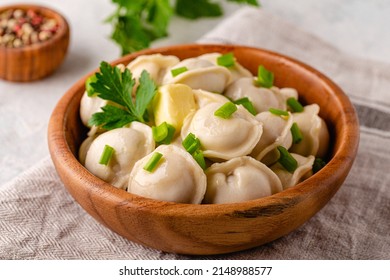 Homemade meat dumplings - russian pelmeni. Dumplings, filled with meat, ravioli.