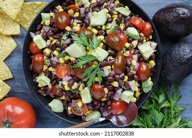 Homemade Mexican Black Bean And Corn Salad Or Texas Caviar Bean Dip Lime Dressing, Served With Tortilla Chips And Fresh Ingredients. Table Top View, Flatlay.