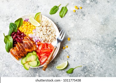 Homemade Mexican Chicken Burrito Bowl With Rice, Beans, Corn, Tomato, Avocado, Spinach. Taco Salad Lunch Bowl