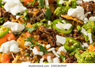 Homemade Mexican Shredded Beef Nachos With Gaucamole And Sour Cream