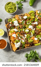 Homemade Mexican Shredded Beef Nachos With Gaucamole And Sour Cream