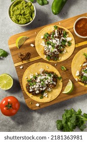 Homemade Mexican Shredded Beef Tacos With Onion And Cheese